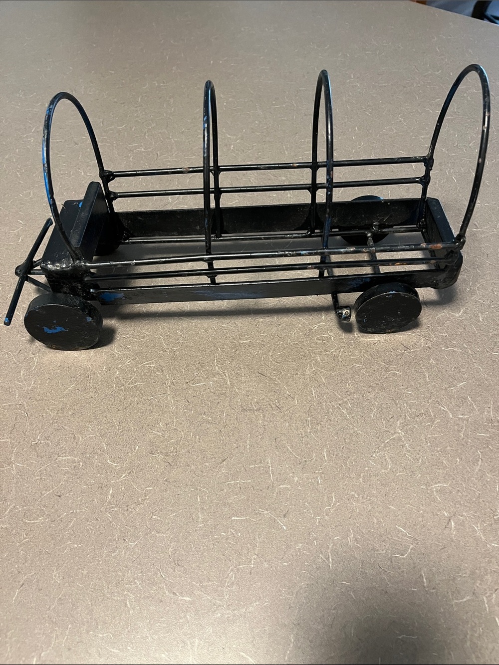 Vtg or Antique handmade metal wagon. Orig blue paint underneath. 14”x5” Heavy